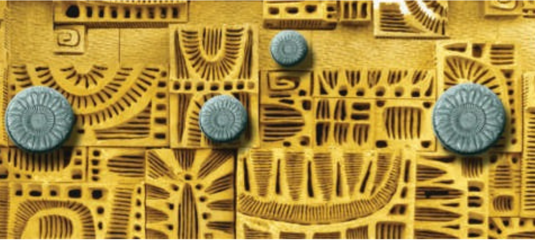 Main Aztec artwork showing intricate golden patterns and circular blue-grey elements.
