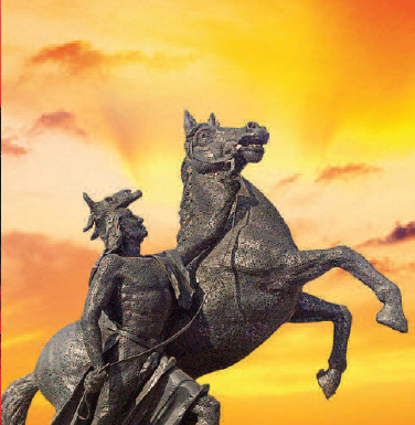 Statue with sunset background