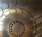 Close-up detail of the Aztec artwork showing metallic textures.